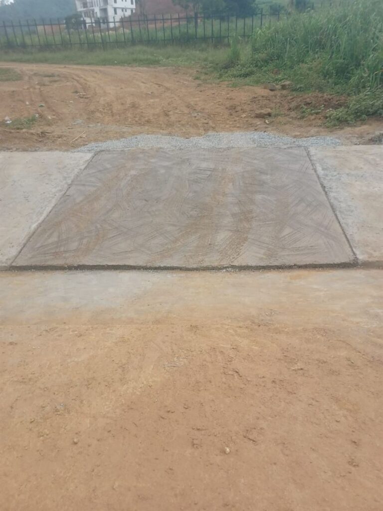 Concrete internal access road at the Ankaase residential development