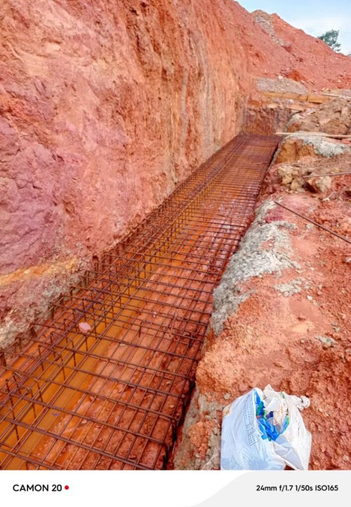 Retaining wall foundation reinforcement in excavation at Ankaase