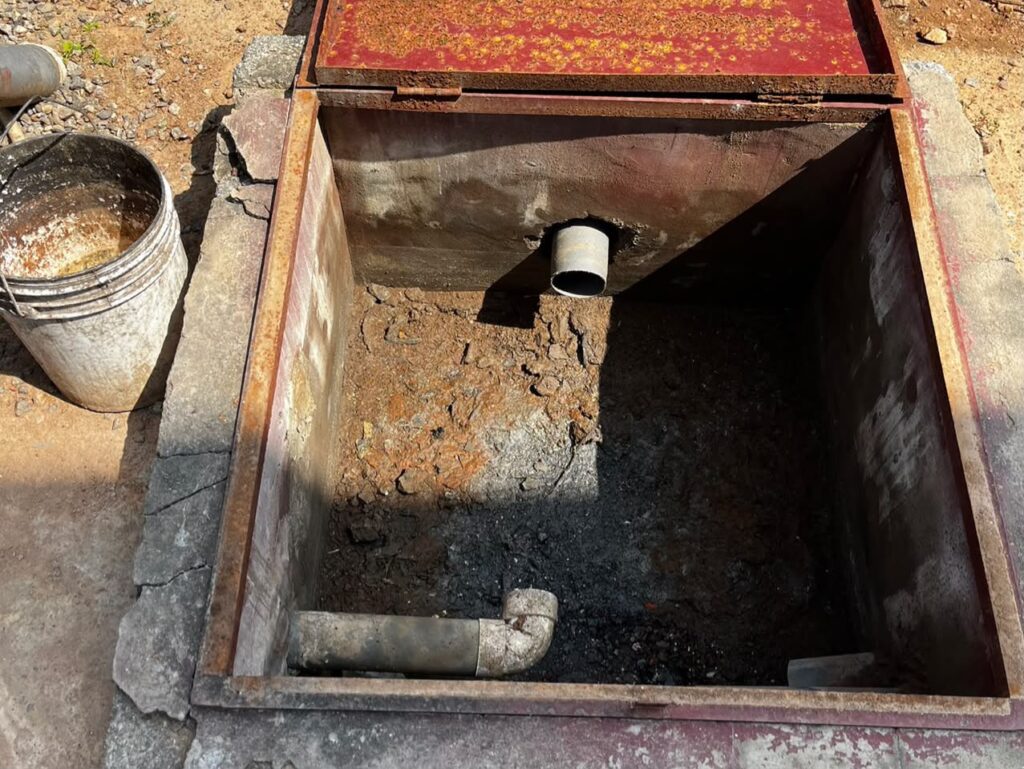Open Biofil toilet system chamber showing internal pipework